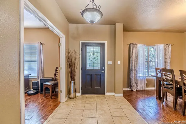 a view of a livingroom with furniture and hardwood floor