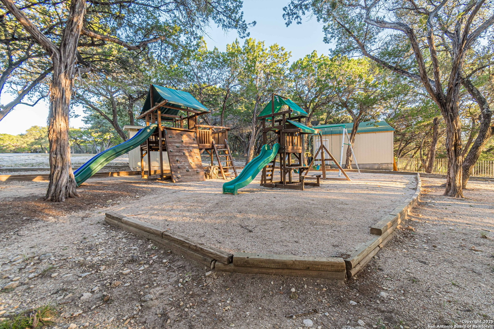 249 Lakeridge Loop Lakehills, TX 78063 - Photo 45 of 50 a view of outdoor space with playground and green space