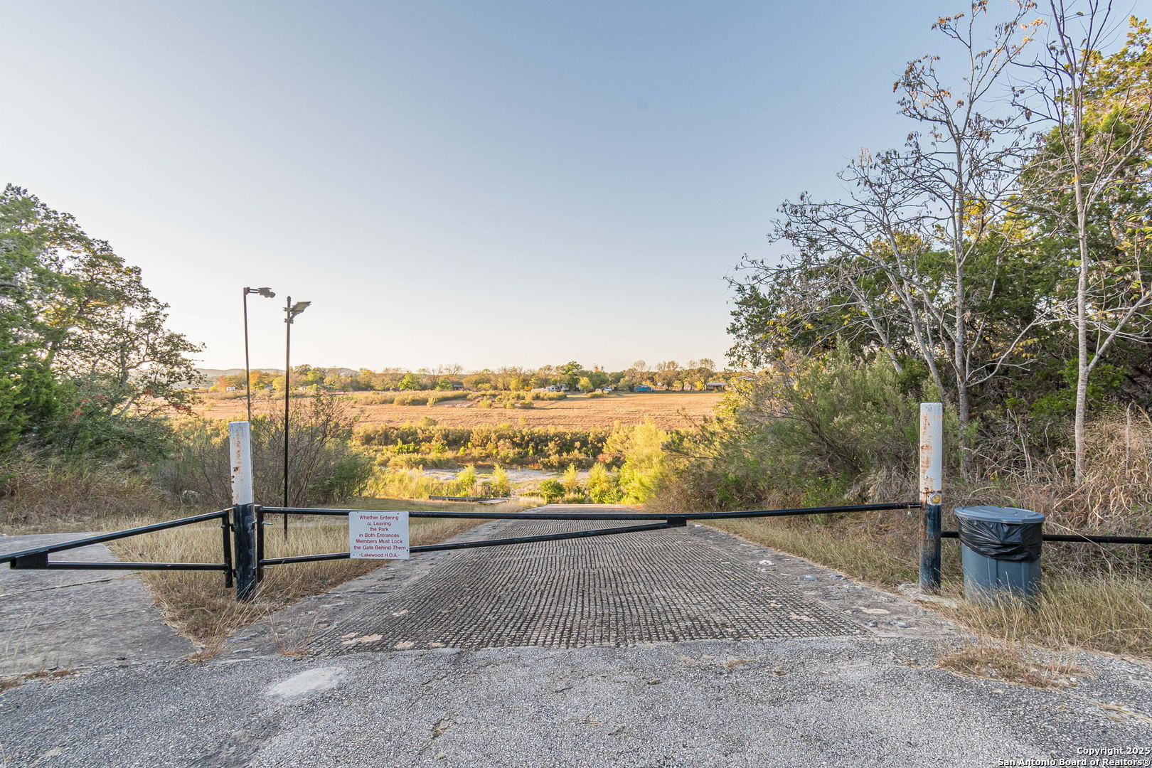 249 Lakeridge Loop Lakehills, TX 78063 - Photo 47 of 50 a view of a pathway with a lake view
