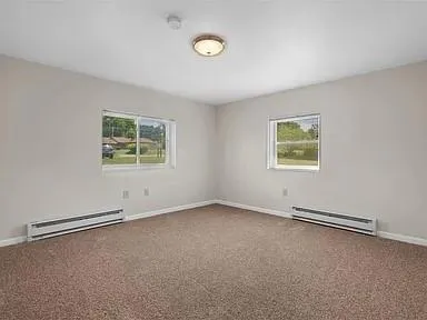an empty room with windows