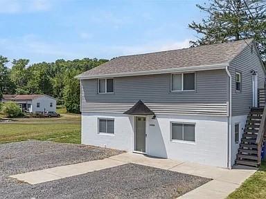 1122 A Pittsburgh Road Valencia, PA 16059 - Photo 2 of 16 a front view of a house with a yard and garage