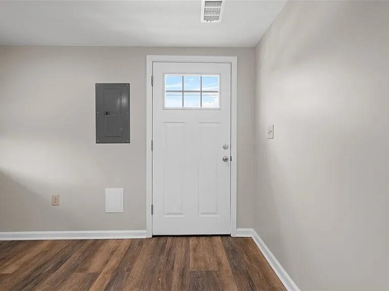 1122 A Pittsburgh Road Valencia, PA 16059 - Photo 4 of 16 an empty room with wooden floor and windows