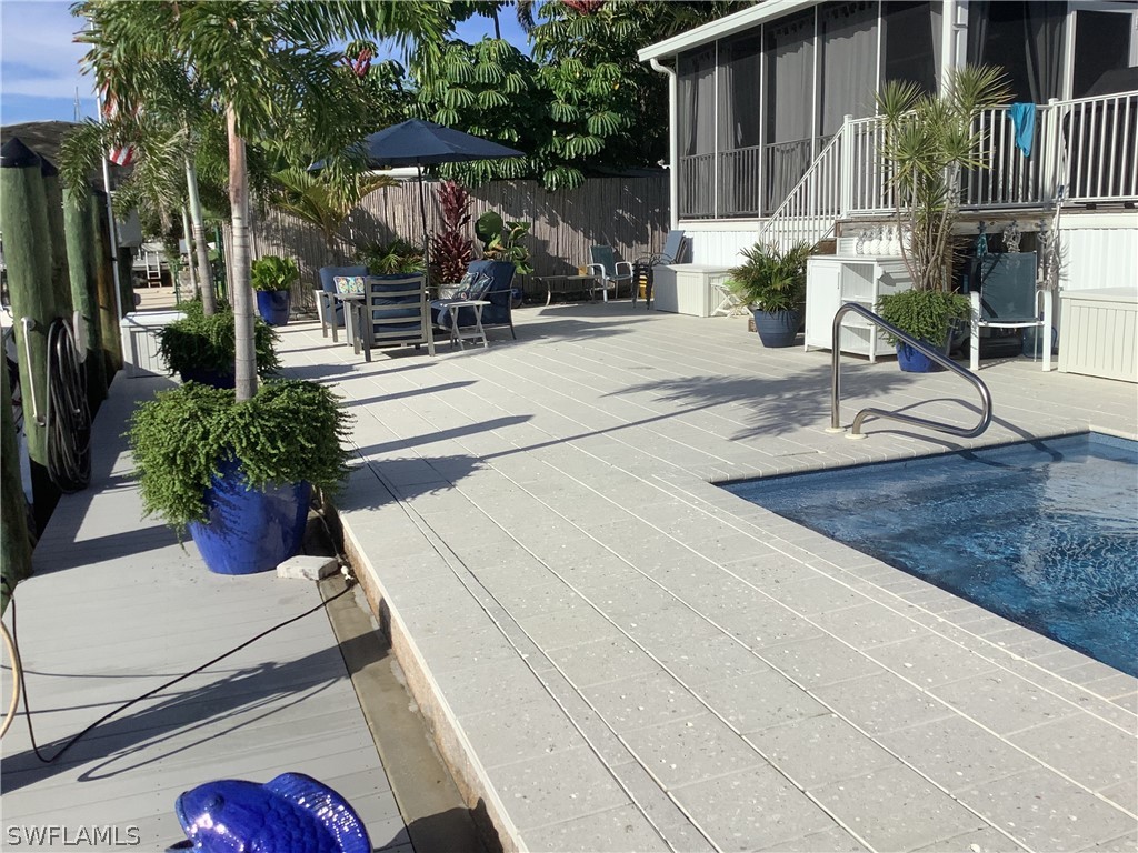 2642 York Road St. James City, FL 33956 - Photo 11 of 14 a view of a house with a patio