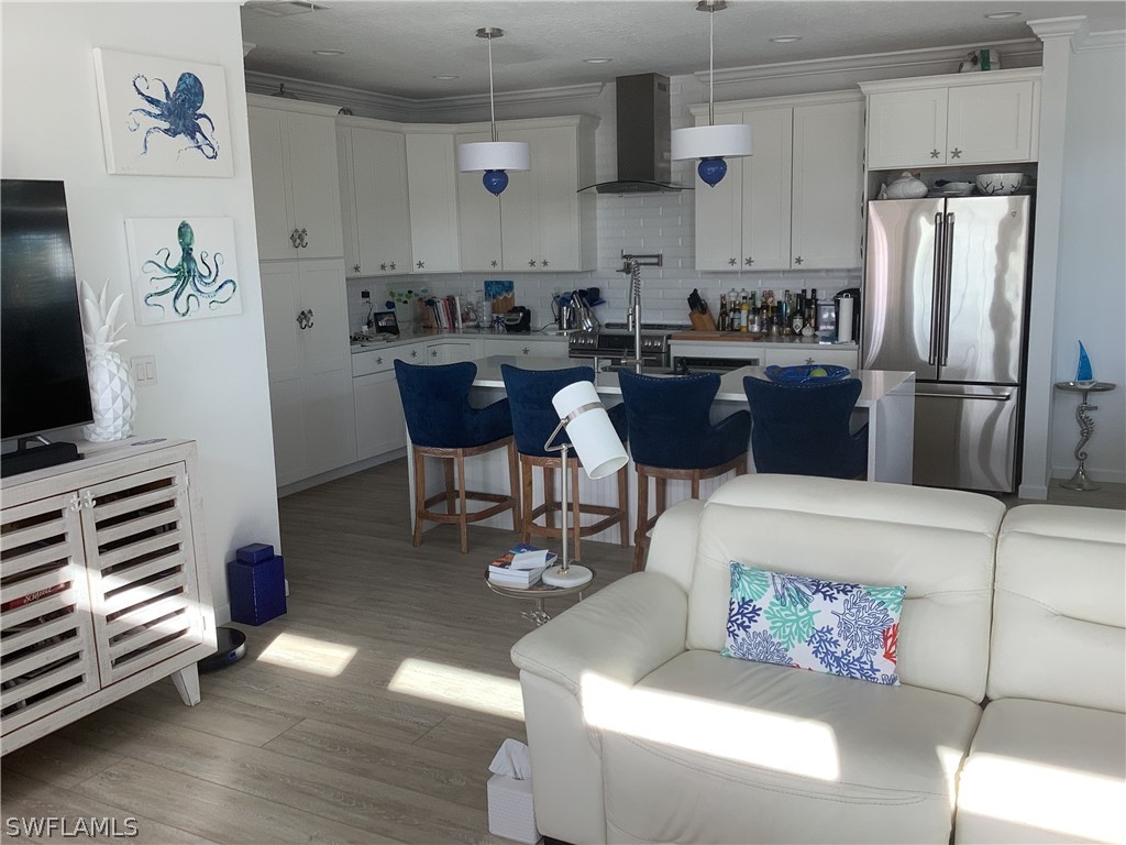 2642 York Road St. James City, FL 33956 - Photo 2 of 14 a kitchen with a refrigerator and a stove top oven