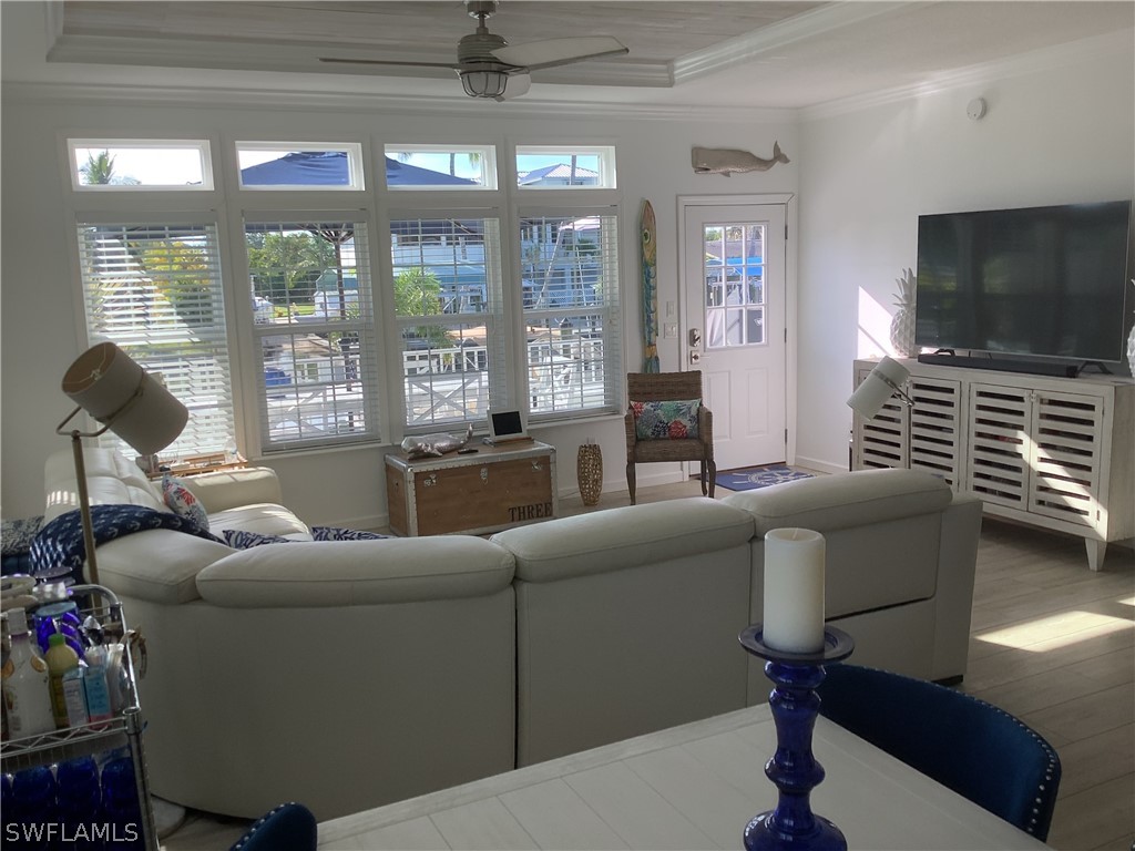 2642 York Road St. James City, FL 33956 - Photo 3 of 14 a living room with furniture and a flat screen tv