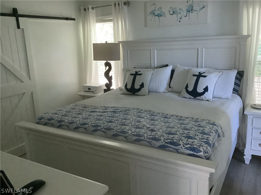2642 York Road St. James City, FL 33956 - Photo 5 of 14 a bedroom with a bed and window
