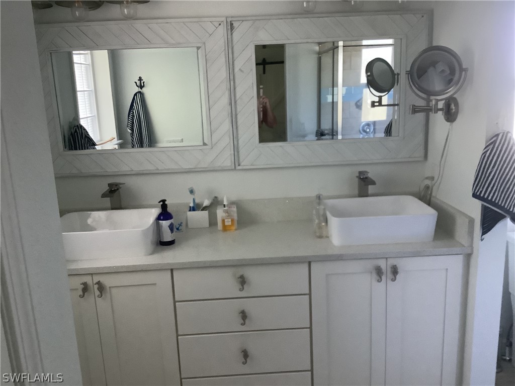 2642 York Road St. James City, FL 33956 - Photo 8 of 14 a bathroom with a sink and a mirror