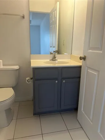 a bathroom with a toilet and a bath tub