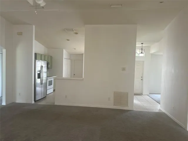 a big room with closet and windows