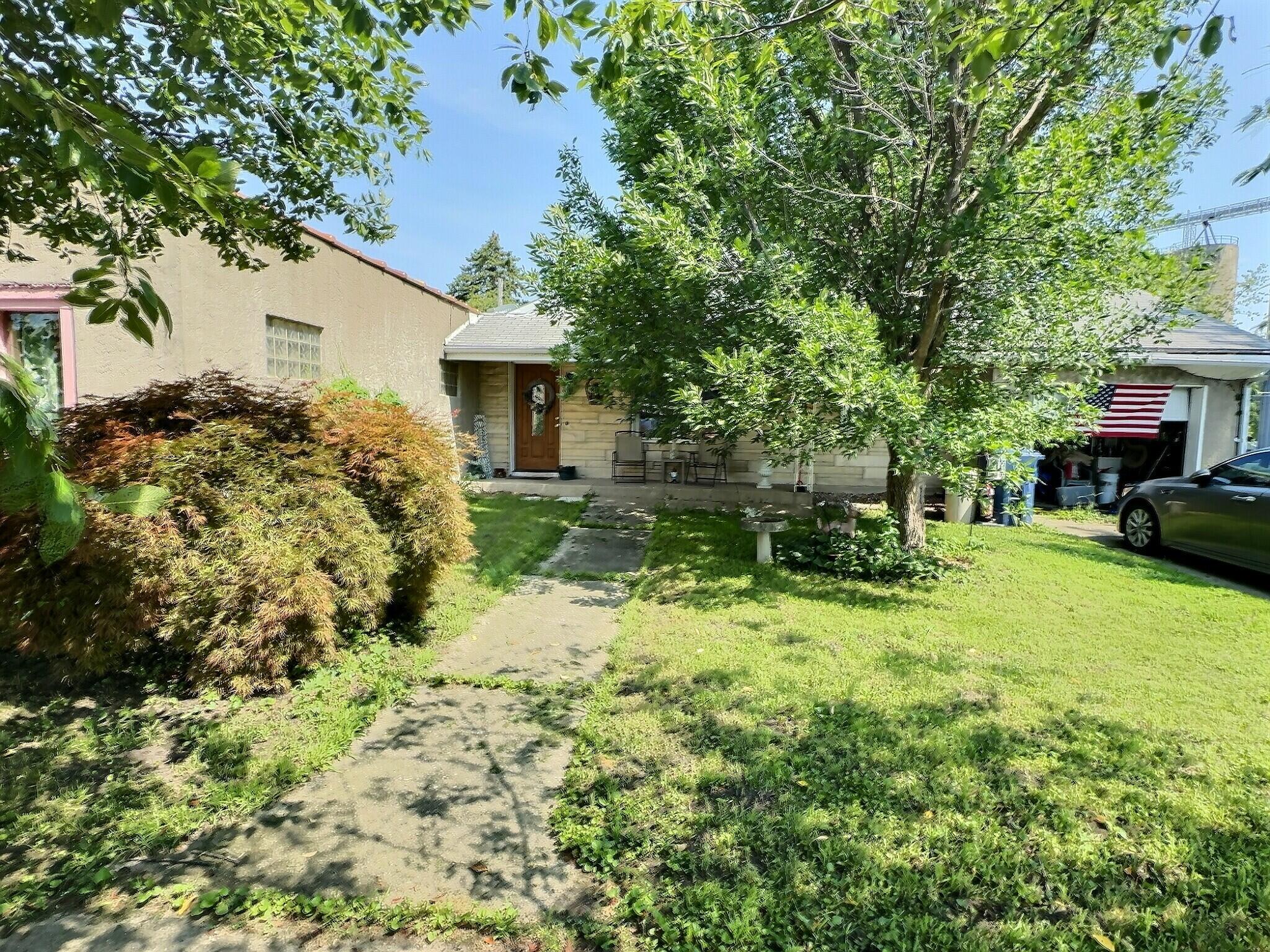 a house view with a garden space