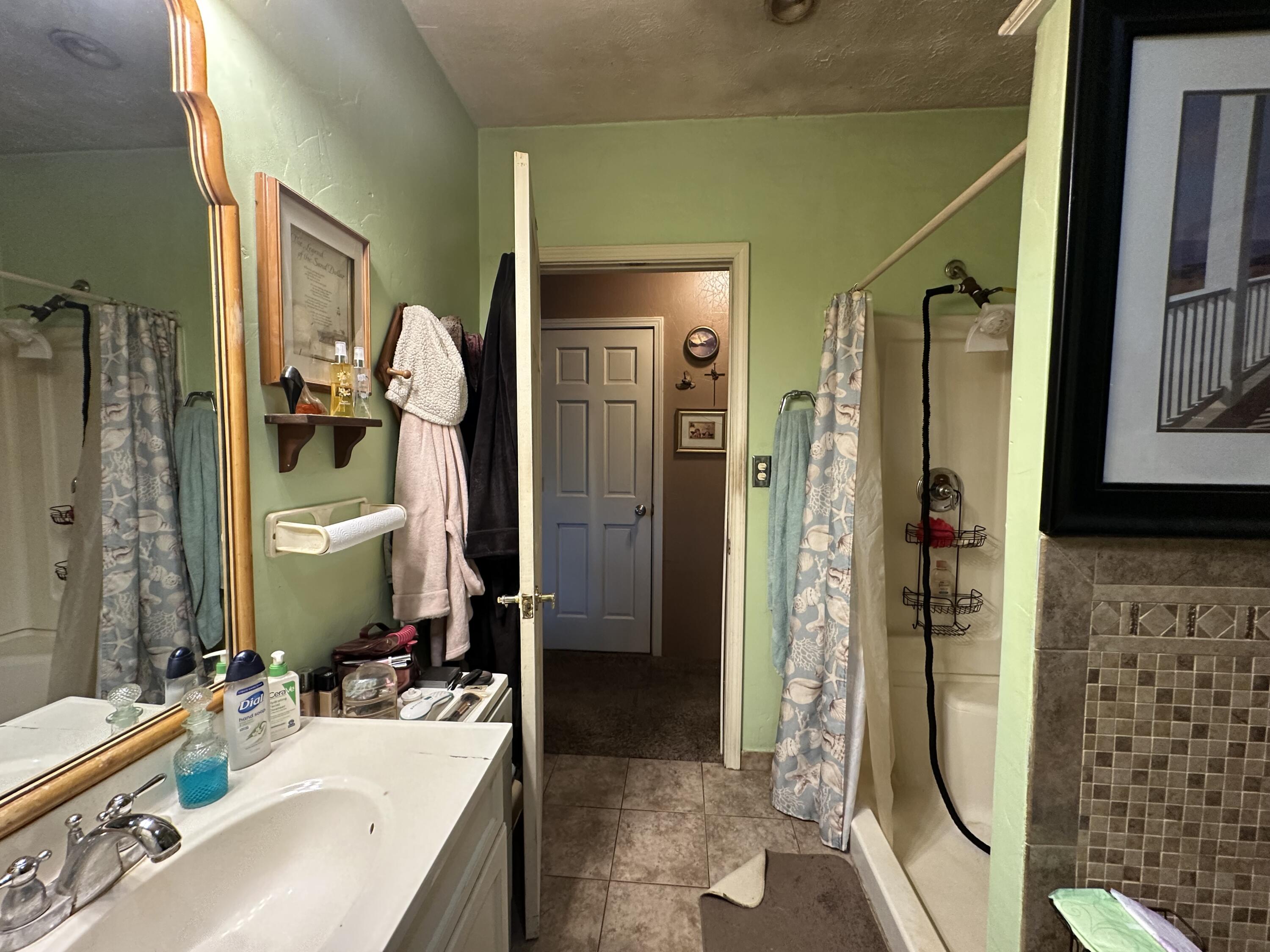 224 East State Street Morocco, IN 47963 - Photo 17 of 17 a bathroom with a tub sink and mirror