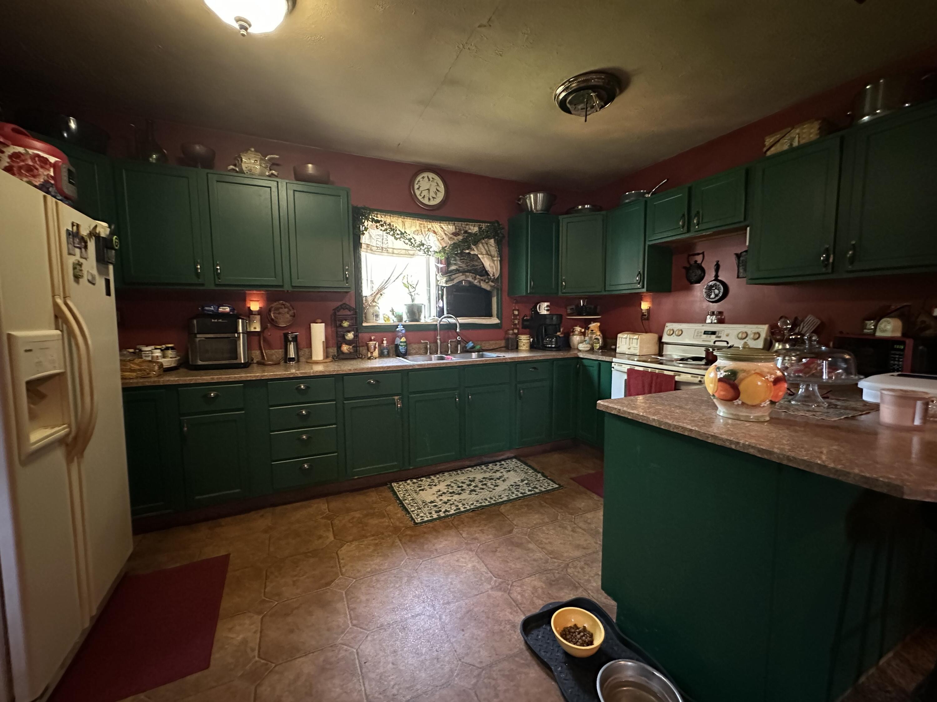 224 East State Street Morocco, IN 47963 - Photo 4 of 17 a kitchen with sink refrigerator and window