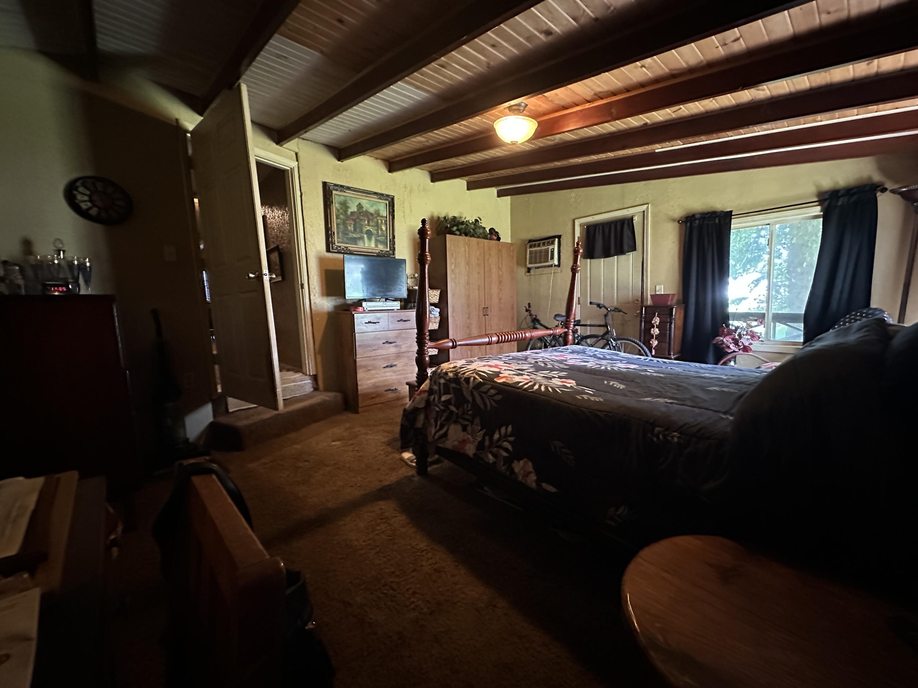224 East State Street Morocco, IN 47963 - Photo 10 of 17 a bedroom with a bed next to a window