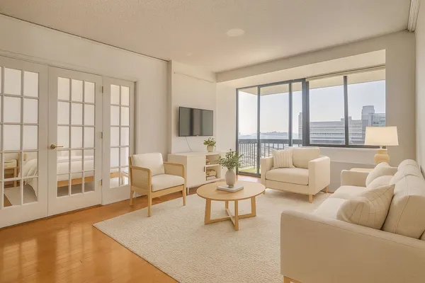 a living room with furniture and a large window