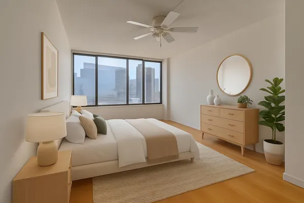 a bedroom with a bed and a chandelier