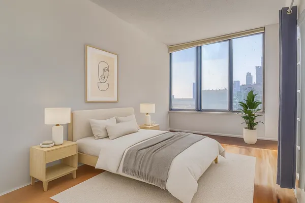 a bedroom with bed and a window