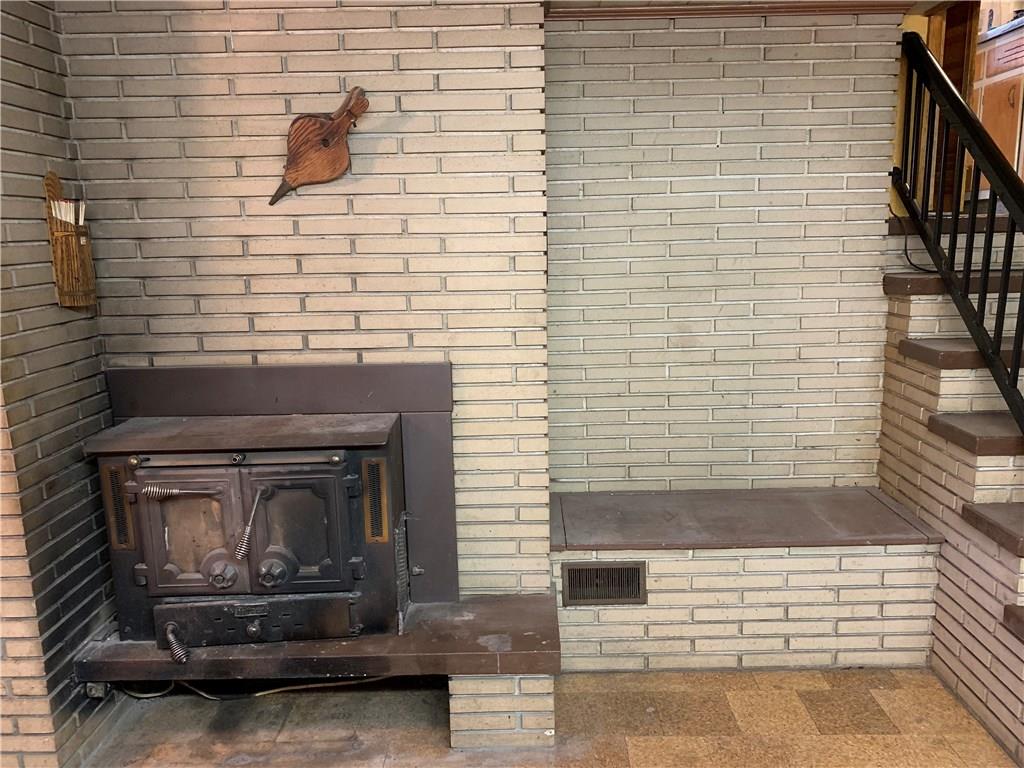 201 Highway 68 Rochester, PA 15074 - Photo 17 of 24 Family room's wood burning fireplace can heat most of the home. Great for utilities.