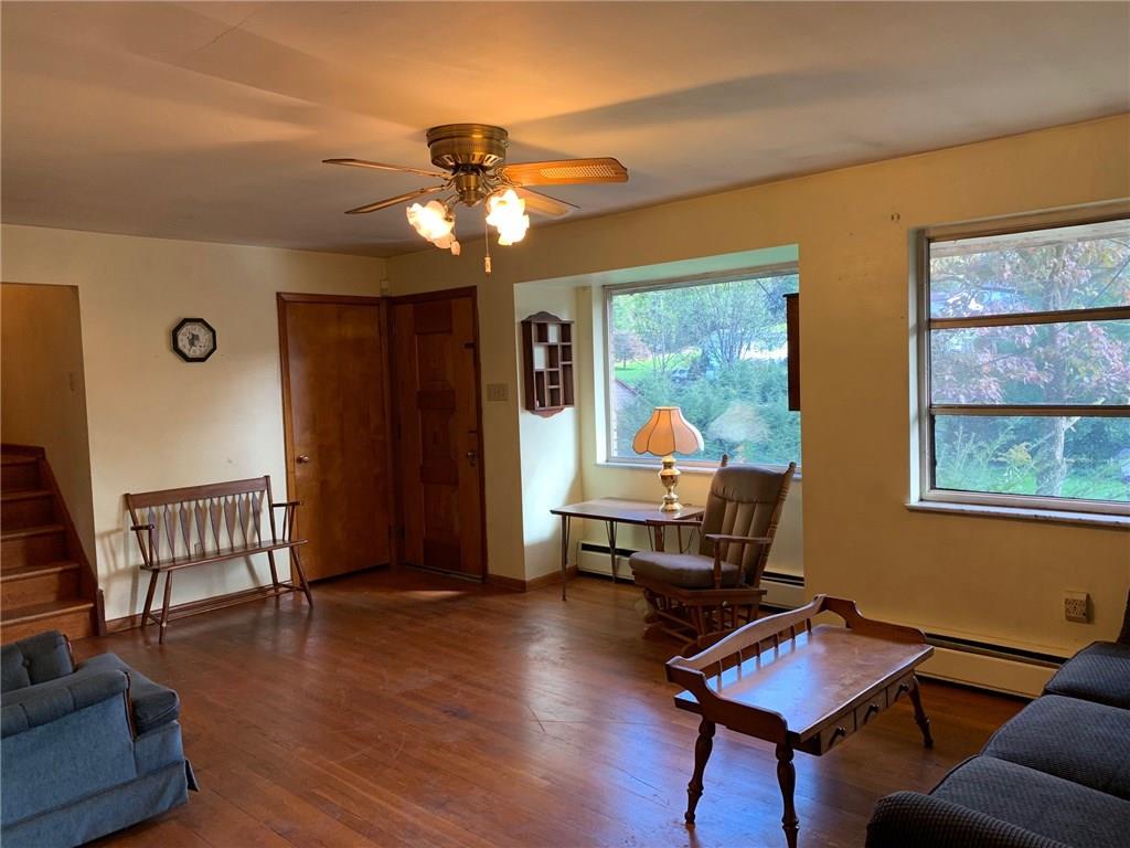 201 Highway 68 Rochester, PA 15074 - Photo 4 of 24 Bright living room with hardwood floors and ceiling fan.