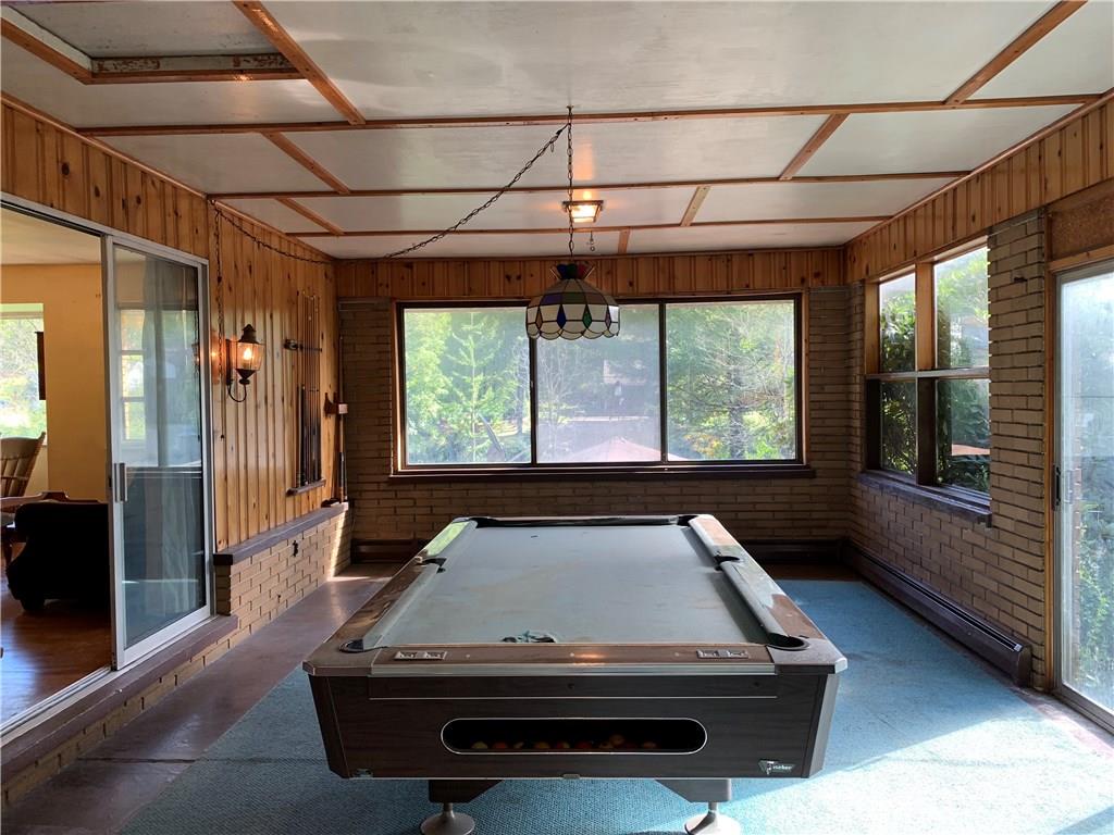 201 Highway 68 Rochester, PA 15074 - Photo 9 of 24 Enormous game room right off the dining room / living room. Look at all that natural light and woodwork! Attic access with so much storage as well.