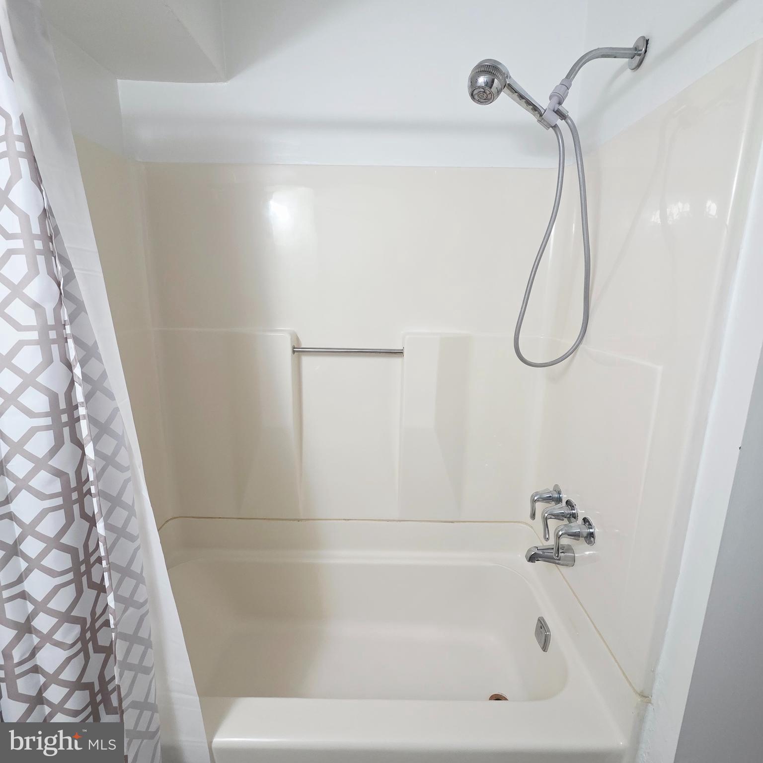 532 South 15th Street, Unit 2 Philadelphia, PA 19146 - Photo 11 of 11 a bathroom with a bath tub with a shower