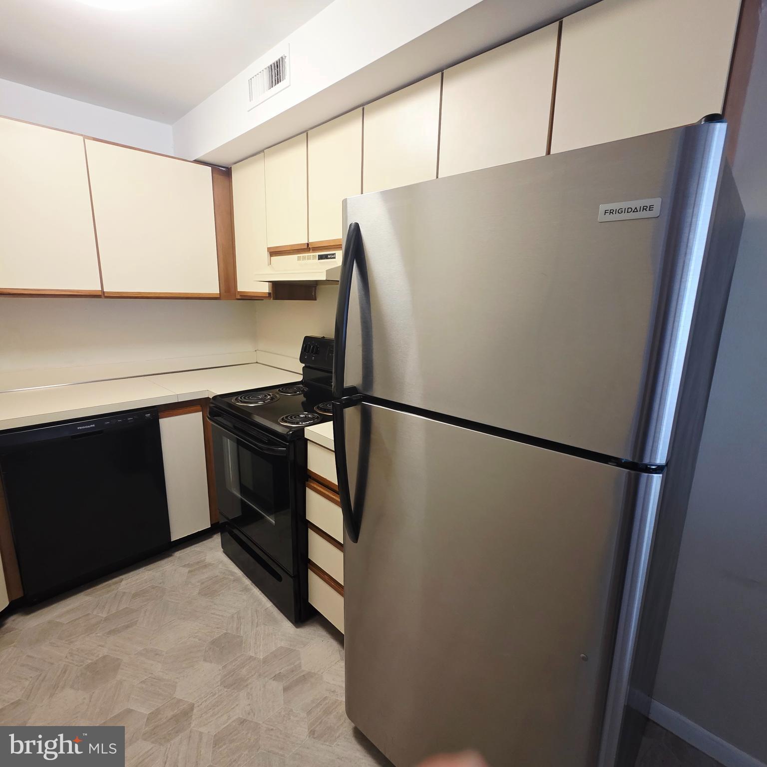532 South 15th Street, Unit 2 Philadelphia, PA 19146 - Photo 7 of 11 a white refrigerator freezer sitting in a kitchen