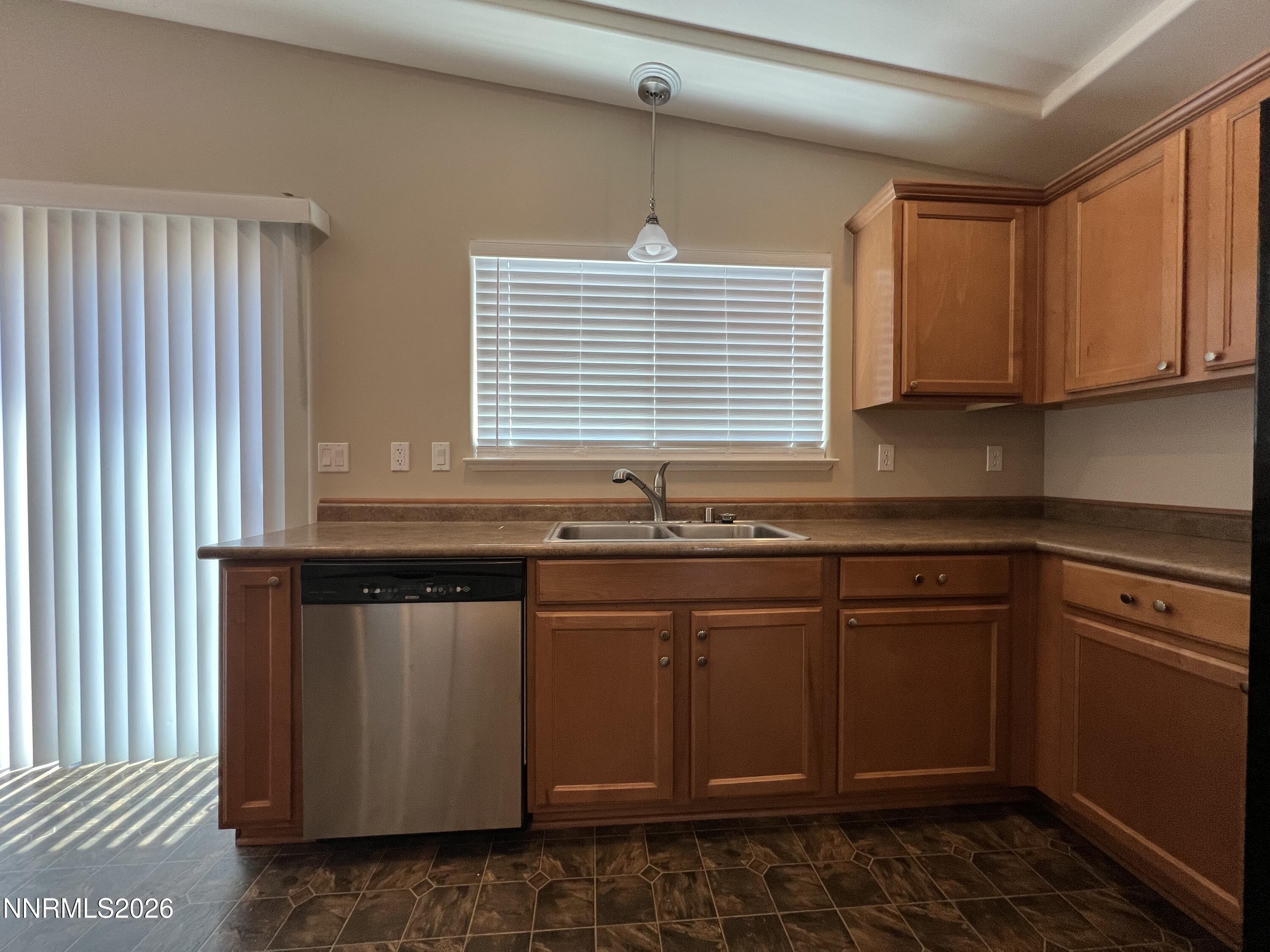 18406 Teddy Bear Court Reno, NV 89508 - Photo 11 of 44 a kitchen with granite countertop sink cabinets and window