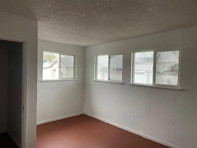 an empty room with windows