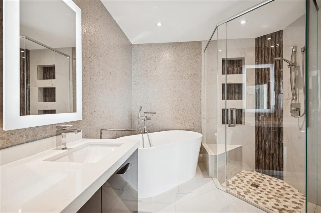 111 Southeast 8th Avenue, Unit 1005 Fort Lauderdale, FL 33301 - Photo 11 of 18 a bathroom with a tub sink and shower