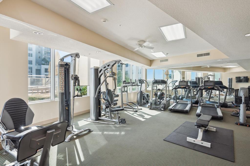 111 Southeast 8th Avenue, Unit 1005 Fort Lauderdale, FL 33301 - Photo 17 of 18 a view of a room with gym equipment
