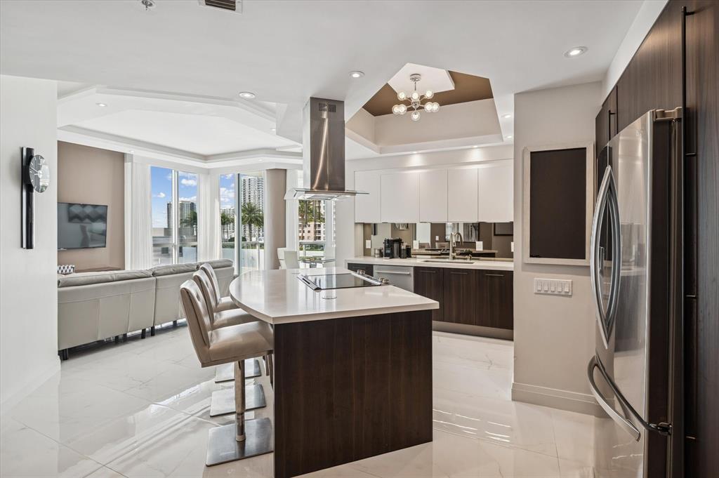 111 Southeast 8th Avenue, Unit 1005 Fort Lauderdale, FL 33301 - Photo 3 of 18 a kitchen with counter top space cabinets and stainless steel appliances