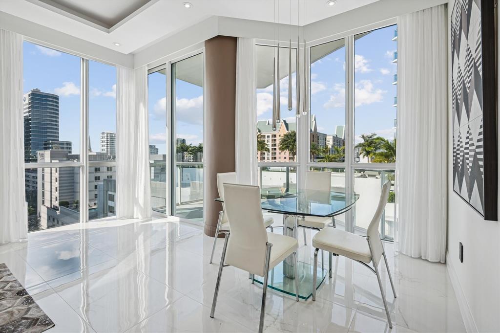 111 Southeast 8th Avenue, Unit 1005 Fort Lauderdale, FL 33301 - Photo 5 of 18 a view of a dining room with furniture window and outside view