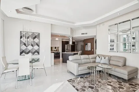 a living room with furniture and white walls