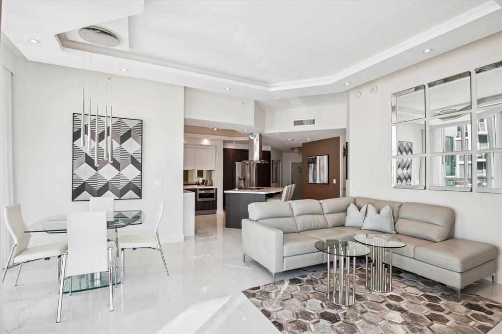 111 Southeast 8th Avenue, Unit 1005 Fort Lauderdale, FL 33301 - Photo 6 of 18 a living room with furniture and white walls