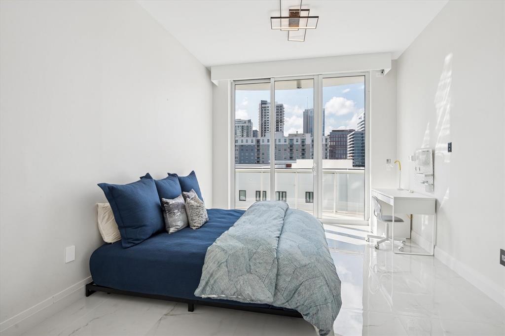 111 Southeast 8th Avenue, Unit 1005 Fort Lauderdale, FL 33301 - Photo 9 of 18 a bedroom with a bed and a large window