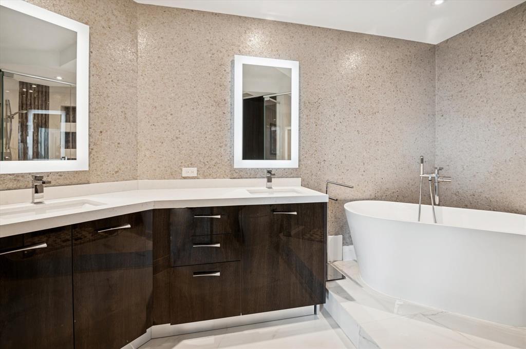 111 Southeast 8th Avenue, Unit 1005 Fort Lauderdale, FL 33301 - Photo 10 of 18 a bathroom with a double vanity sink and mirror