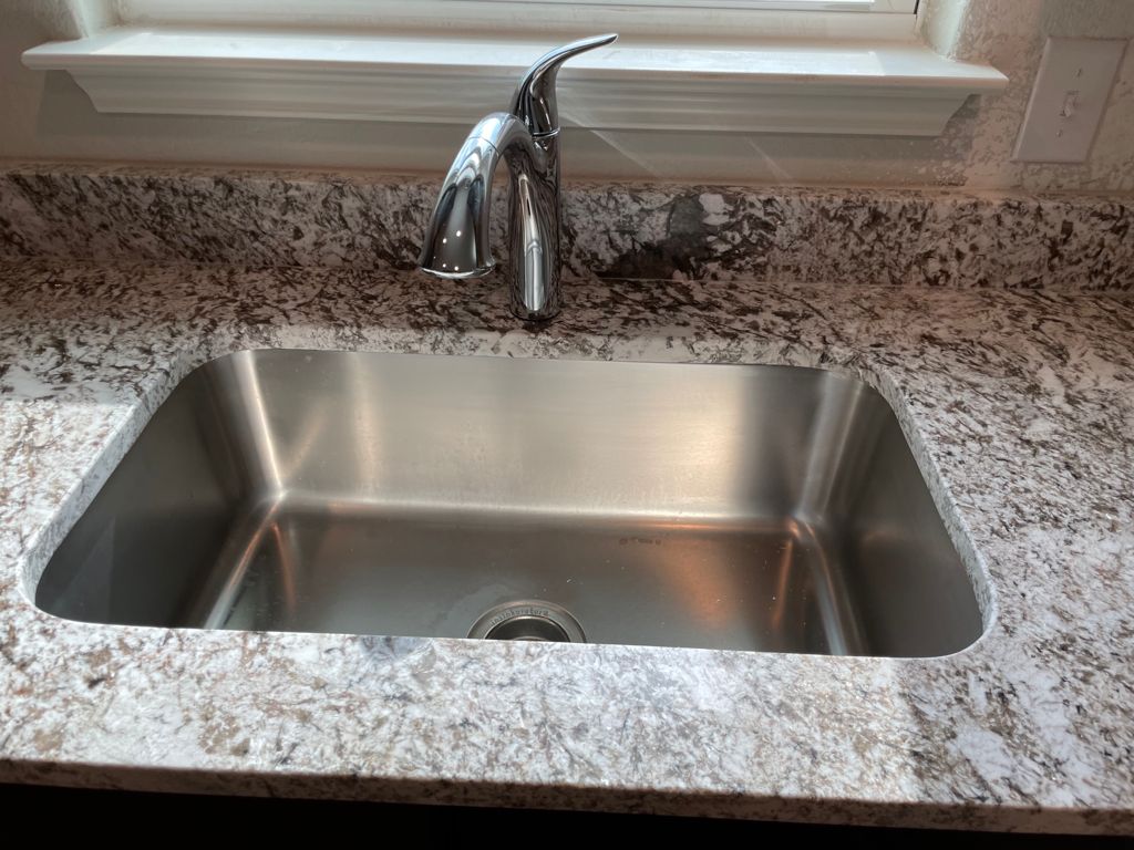 109 Declaration Lane Liberty Hill, TX 78642 - Photo 12 of 24 Kitchen view of light stone countertops and a sink