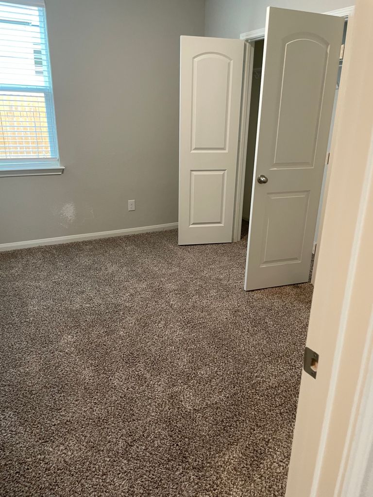 109 Declaration Lane Liberty Hill, TX 78642 - Photo 21 of 24 Empty room featuring carpet and baseboards