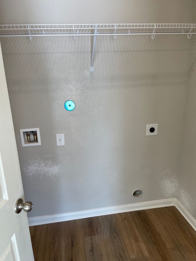 109 Declaration Lane Liberty Hill, TX 78642 - Photo 4 of 24 Laundry area with washer hookup, dark wood-style floors, and electric dryer hookup