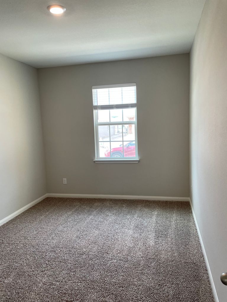 109 Declaration Lane Liberty Hill, TX 78642 - Photo 8 of 24 Spare room with baseboards and carpet