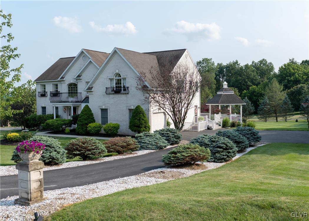 90 Mansfeld Road Hellertown, PA 18055 - Photo 3 of 50 a front view of a house with a yard