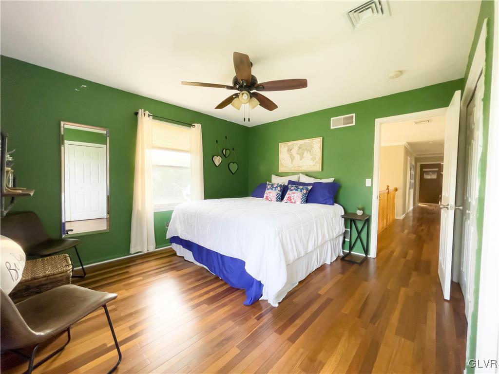 90 Mansfeld Road Hellertown, PA 18055 - Photo 34 of 50 a bed room with a bed and a chandelier