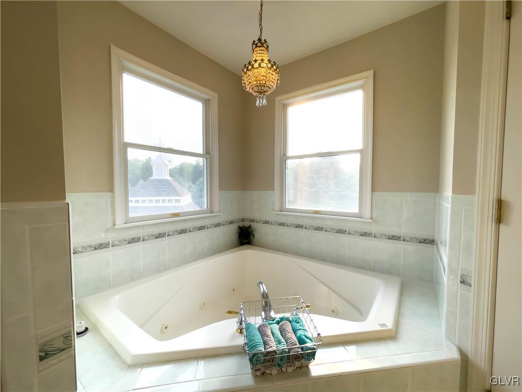 90 Mansfeld Road Hellertown, PA 18055 - Photo 43 of 50 a bath tub sitting in a bathroom next to a window