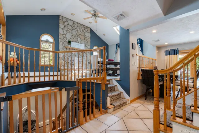 a view of entryway with stairs and wooden floor