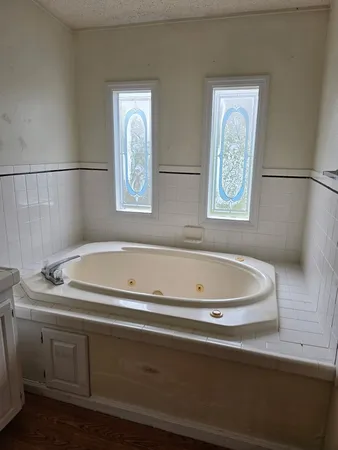 a bathroom with a bathtub and a shower