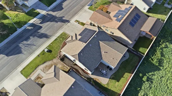 an aerial view of a house with a garden