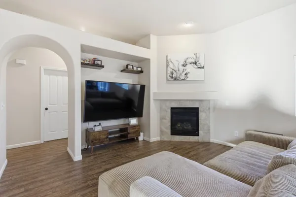 a living room with furniture and a flat screen tv