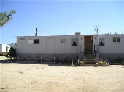 1731 Green Road Pinon Hills, CA 92372 - Photo 1 of 1 a view of a house with snow on the road