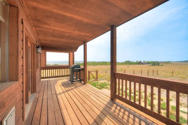 a view of balcony with wooden floor