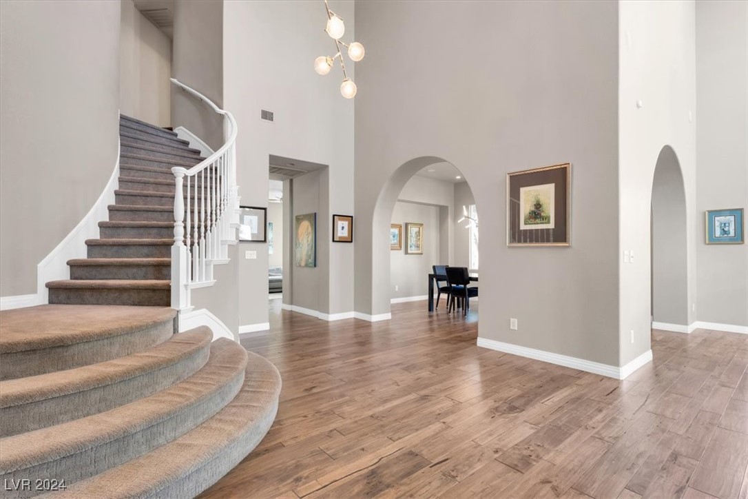 11348 La Madre Ridge Drive Las Vegas, NV 89135 - Photo 12 of 75 Grand two-story entry leading to formal living room and dining room. Featuring updated hardwood floors.