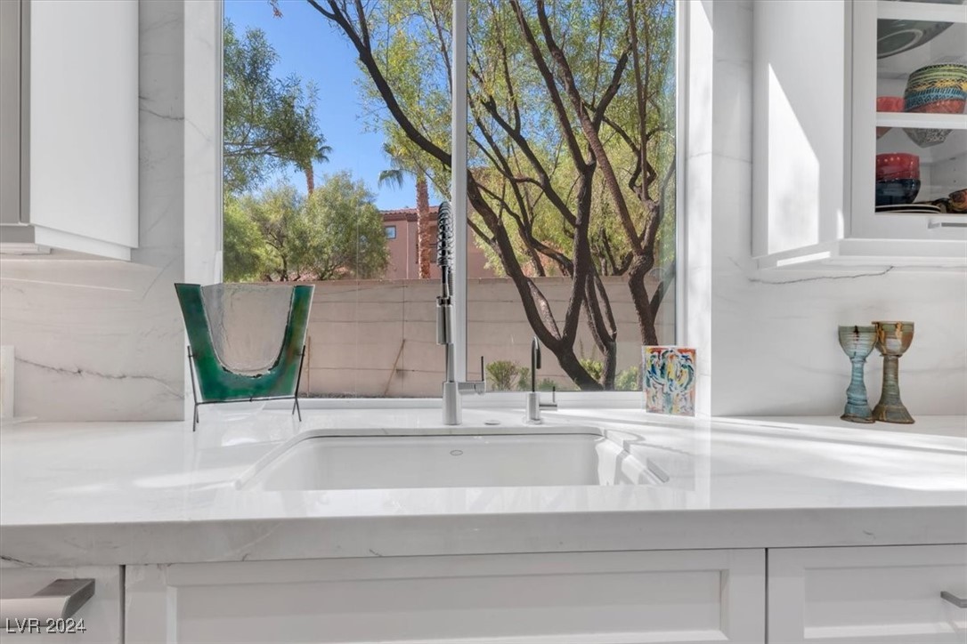 11348 La Madre Ridge Drive Las Vegas, NV 89135 - Photo 20 of 75 Kitchen sink with views to the backyard.